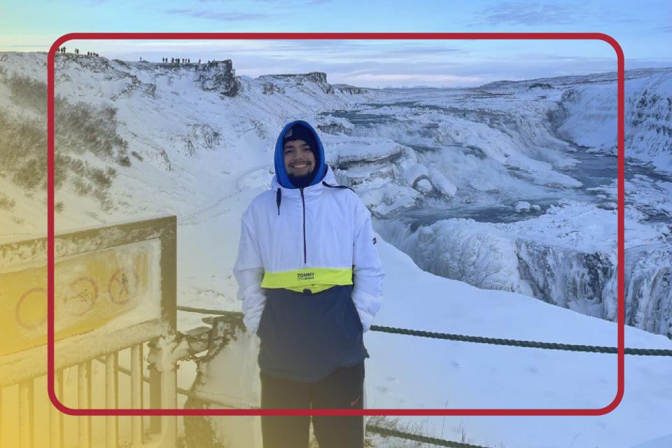 A male student in a snowy mountain