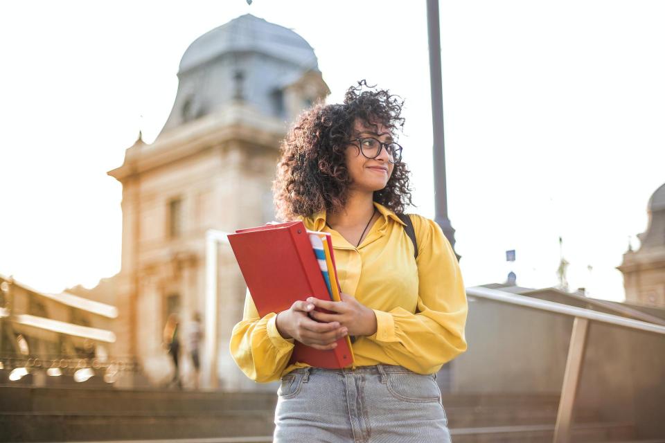 Student holding textbook