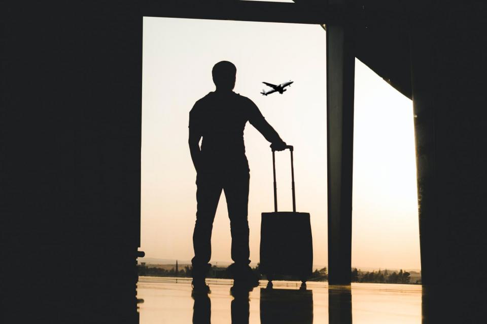 Student looking at flying plane